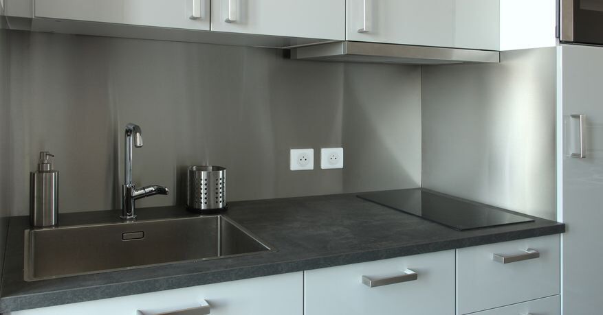Kitchenette renovation with a stainless steel backsplash