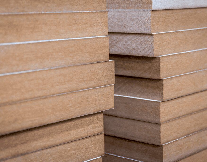 What materials make up MDF boards?
